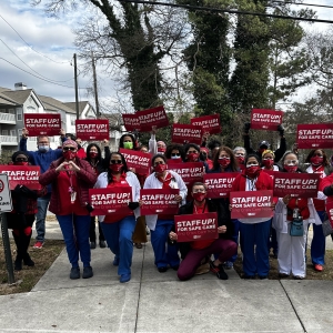 Atlanta VA Nurses holding up signs that say "Staff up for safe care!"