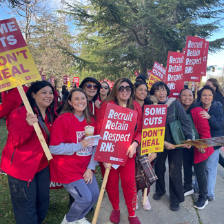 Nurses on picket line, smiling