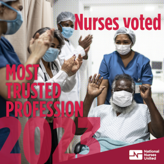 Group of nurses inside hospital giving thumbs up