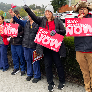 MarinHealth nurses in line with signs "Safe staffing now" "Fair contract now"