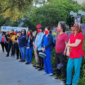 Line of nurses outside PIH Health Good Samaritan Hospital