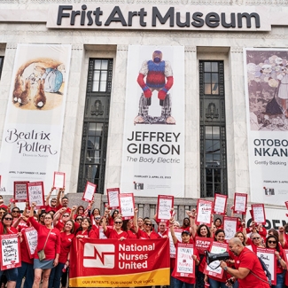 Large group of nurses holding protest outside of Frist Art Museum