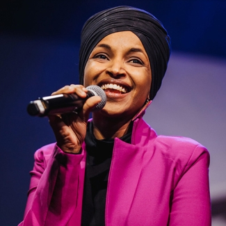 Congresswoman Ilhan Omar holding microphone