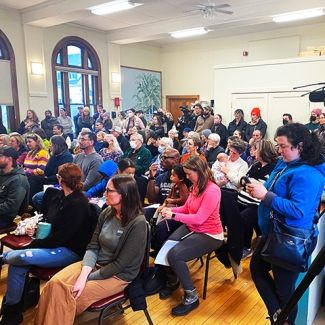 Large group of people in meeting room