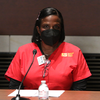 NNU and NYSNA President Nancy Hagans in front of microphone