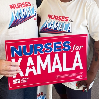 Nurses holding signs "Nurses for Kamala", "Harris, Walz"