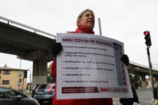 nurse holding sign