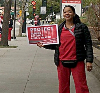 nurses holding signs