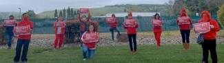 nurses holding signs