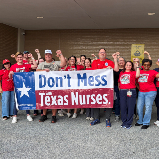 St. Jospeh's nurses hold banner that reads "Don't mess with Texas Nurses!"