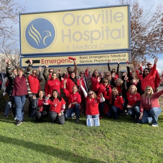 Oroville nurses pose at action in front of Oroville Hospital