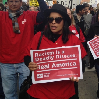 nurses holding signs