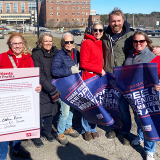 Nurses with Graham Platner, holding signs of support