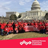 Nurses in front of U.S. Capitol holding banner "Strong Union, Nurses, Veterans"