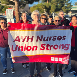 Antelope Valley nurses holding banner "AVH Nurses Union Strong"