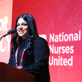 Executive Director Puneet Maharaj speaking at NNU Nurses for Democracy event