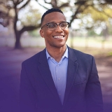 Congressional candidate Christian Menefee outside, smiling