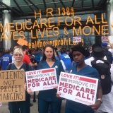 Nurses holding signs