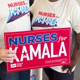 Nurses holding signs "Nurses for Kamala", "Harris, Walz"