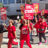 Nurses on strike line outside hospital
