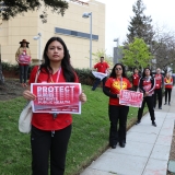 nurses holding signs