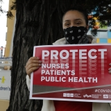 nurse holding sign