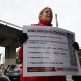 nurse holding sign