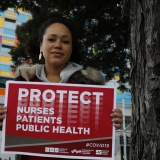 nurse holding sign