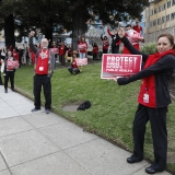 nurses holding signs
