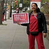 nurses holding signs