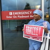 nurse holding sign