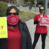 nurses holding signs