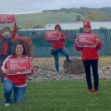 nurses holding signs