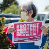 nurse holding sign