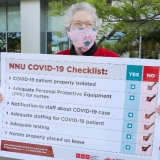 nurse holding sign