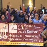 Barton Nurses in front of banner