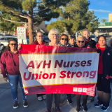 AVMC nurses with "Union Strong!" banner in front of facility