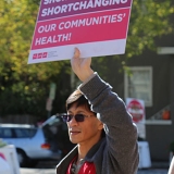 Health care workers with signs